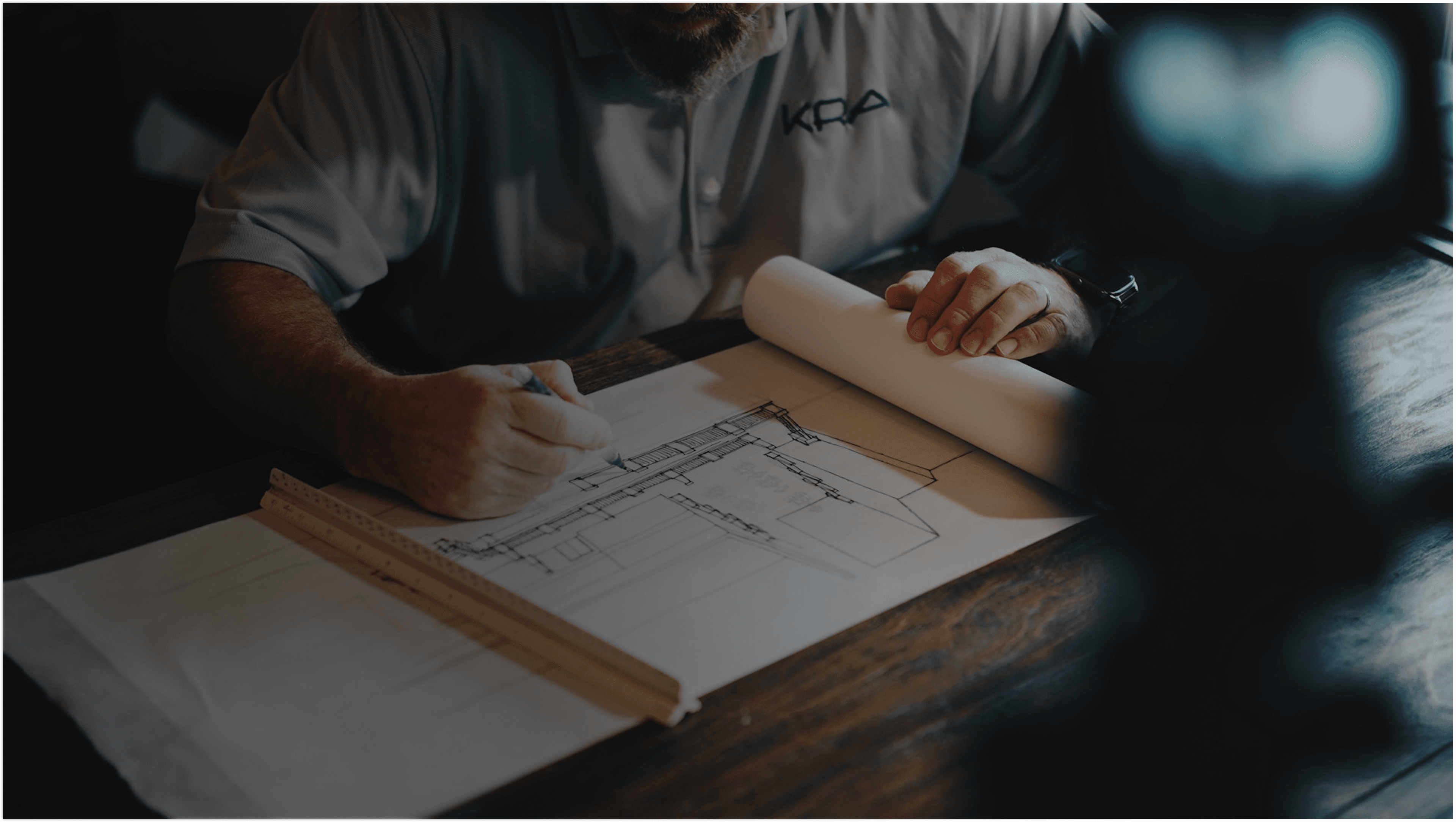 Architect reviewing blueprints